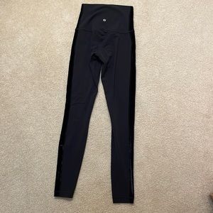 Lululemon black Align leggings with velvet stripe on side on leg.